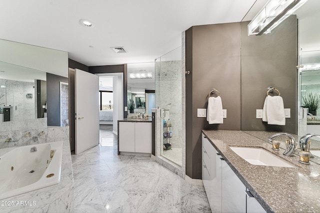 bathroom featuring a sink, a shower stall, a tub with jets, and visible vents