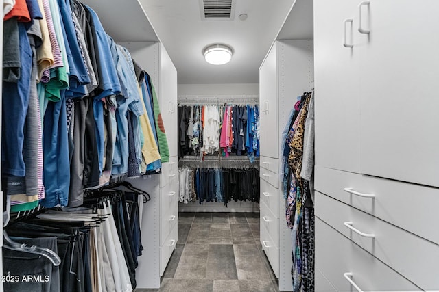 walk in closet with visible vents