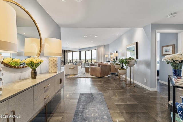 interior space with baseboards and recessed lighting