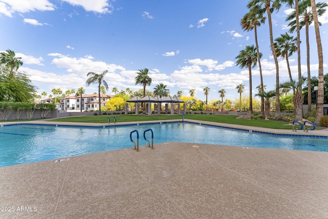 community pool featuring a lawn, a patio, and a gazebo