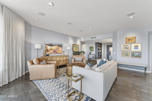 living area featuring recessed lighting, baseboards, and visible vents