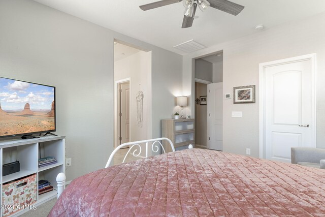 unfurnished bedroom with a ceiling fan, carpet, and visible vents