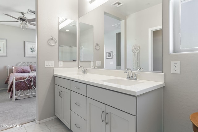 bathroom with vanity, ceiling fan, and tile patterned flooring