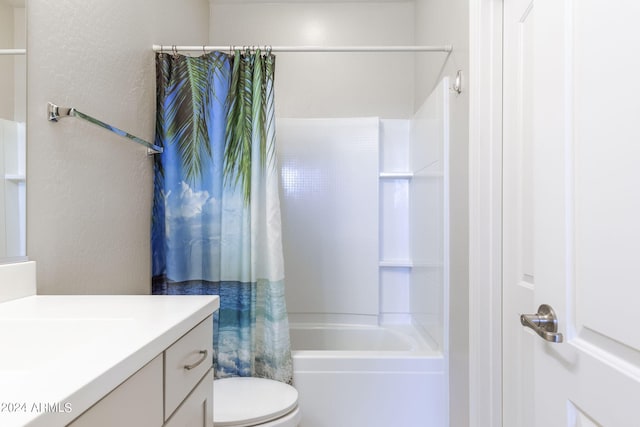 full bathroom featuring toilet, shower / bath combo with shower curtain, and vanity