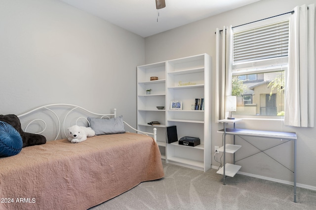 bedroom featuring ceiling fan, carpet floors, and baseboards