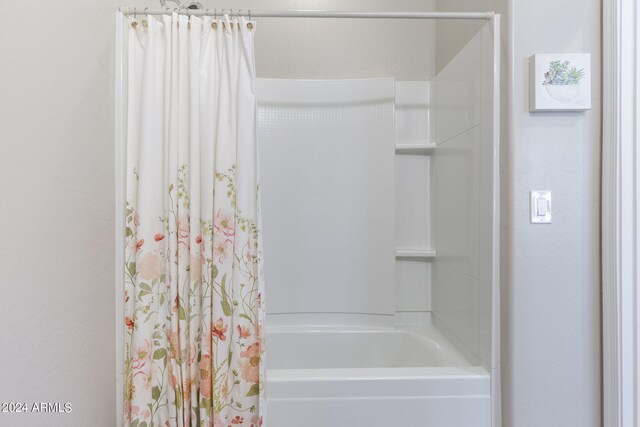 bathroom featuring shower / bath combination with curtain