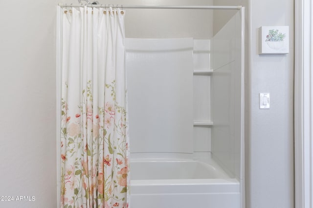 full bath with shower / bathtub combination with curtain