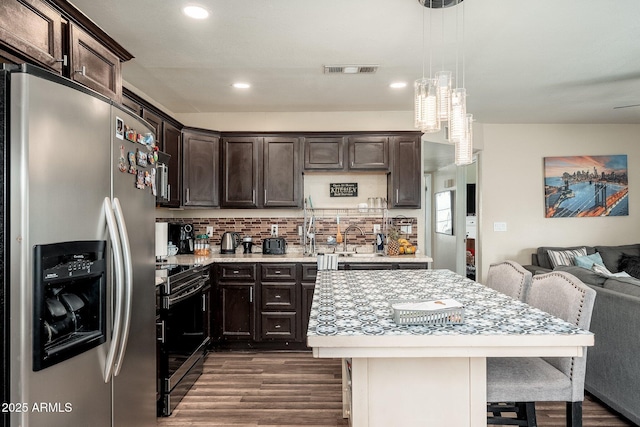 11450 E Elton Ave, Mesa, AZ 85208 - kitchen with stainless steel appliances, light countertops, dark wood-style floors, dark brown cabinetry, and recessed lighting