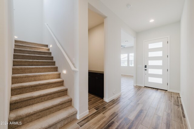 entryway with hardwood / wood-style flooring