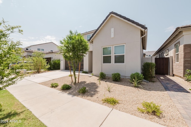 view of front of home featuring driveway and stucco siding