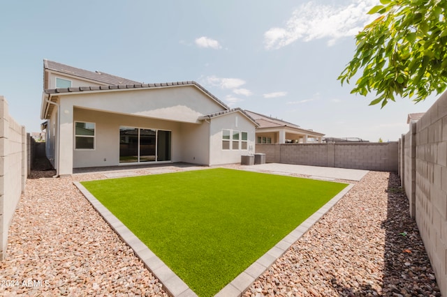 back of property featuring central AC and a patio area