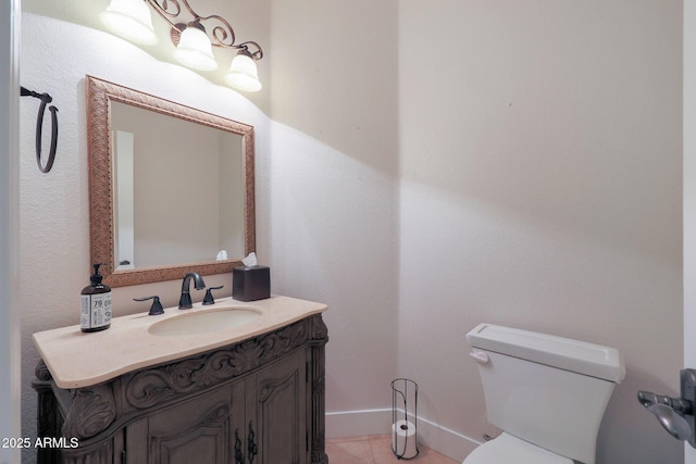 bathroom with vanity, tile patterned floors, and toilet