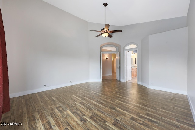 empty room featuring ceiling fan and dark hardwood / wood-style floors