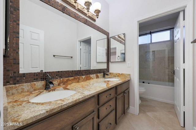 full bathroom featuring toilet, tasteful backsplash, bath / shower combo with glass door, vanity, and tile patterned flooring