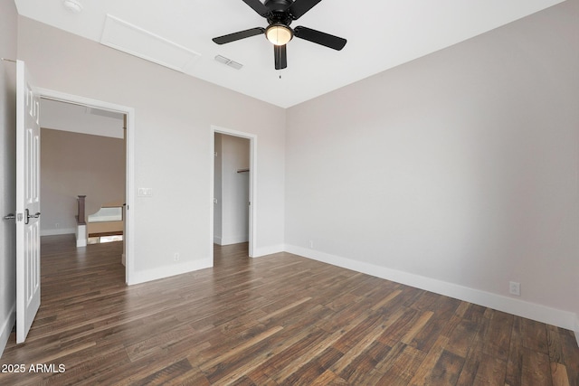 unfurnished bedroom with dark hardwood / wood-style flooring and ceiling fan