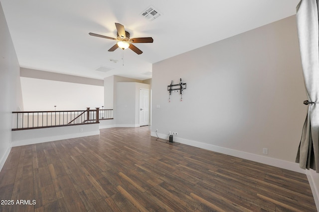 spare room with dark hardwood / wood-style floors and ceiling fan