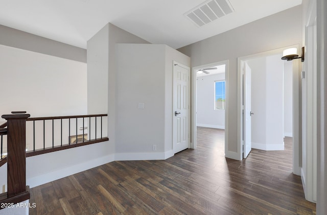 spare room with dark hardwood / wood-style floors