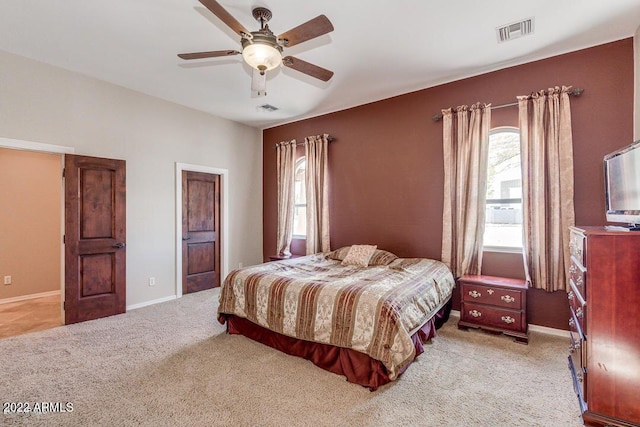 carpeted bedroom with ceiling fan