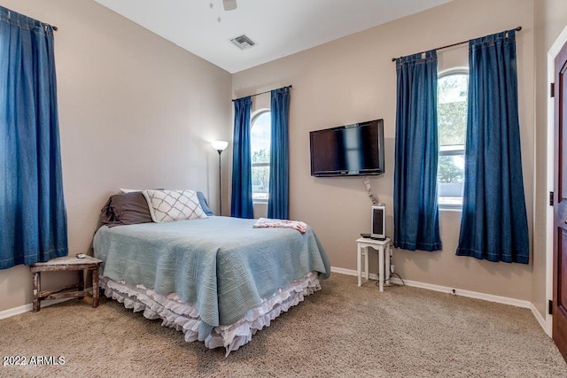 bedroom with ceiling fan and carpet floors