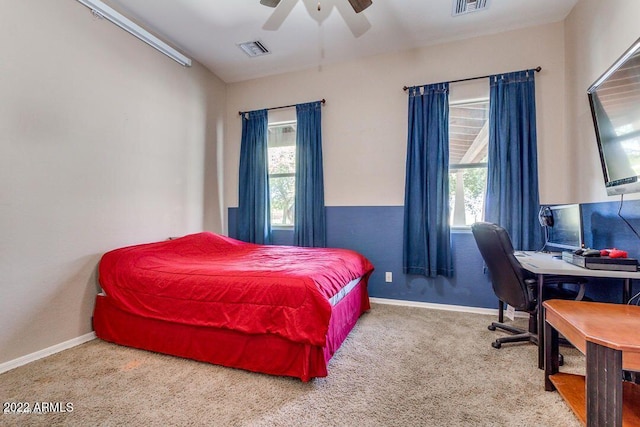 bedroom featuring multiple windows, carpet floors, and ceiling fan