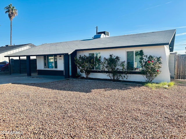 ranch-style house featuring central AC unit