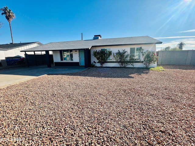 view of front of property with a carport