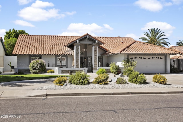 1015 E Paradise Ln, Phoenix, AZ 85022 - mediterranean / spanish-style house with stucco siding, a tiled roof, driveway, and a garage