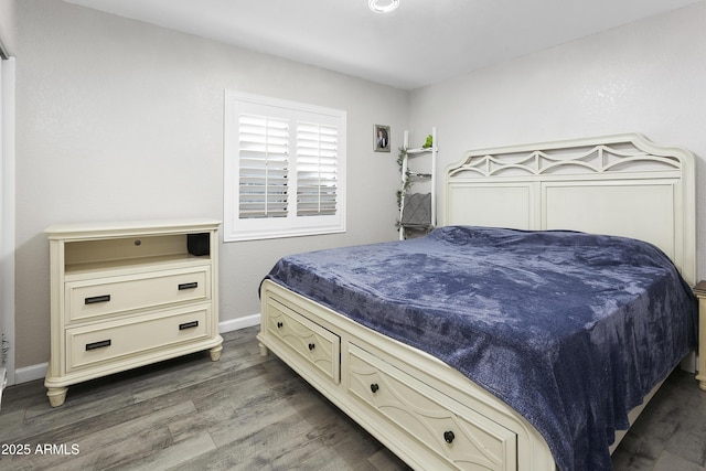 1015 E Paradise Ln, Phoenix, AZ 85022 - bedroom featuring dark wood finished floors and baseboards