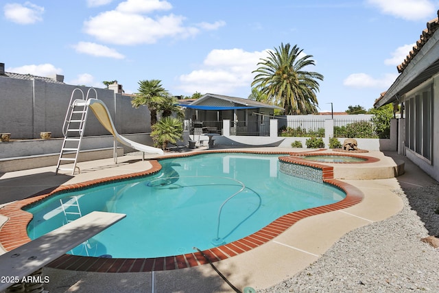 1015 E Paradise Ln, Phoenix, AZ 85022 - view of swimming pool with a water slide, a diving board, a fenced backyard, a patio, and a gazebo