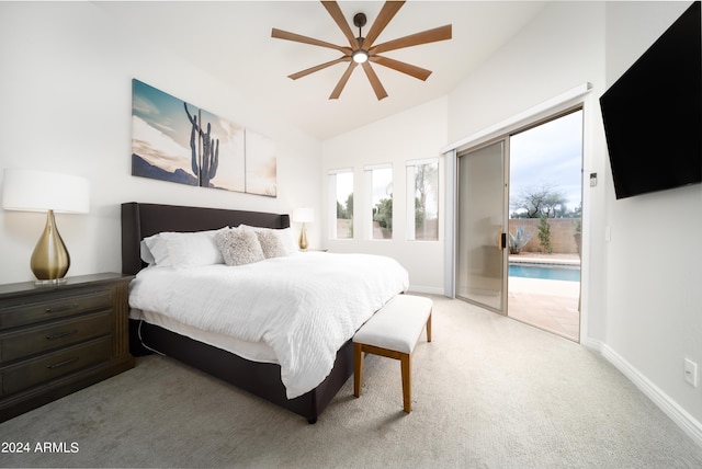 bedroom featuring multiple windows, access to exterior, vaulted ceiling, and light colored carpet