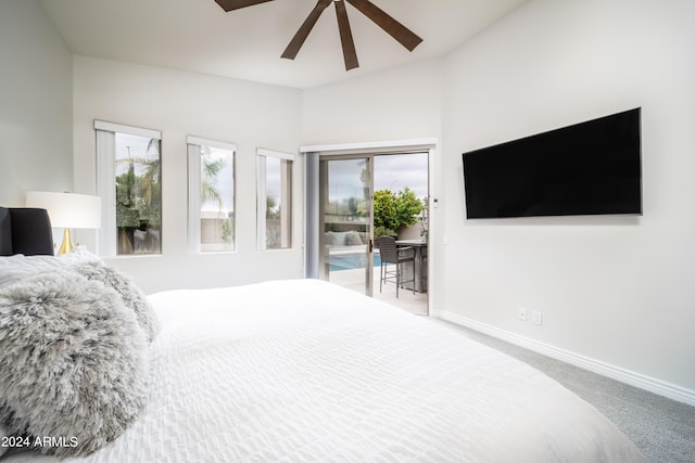 carpeted bedroom with ceiling fan and access to exterior