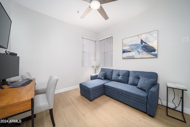 office space featuring ceiling fan and light wood-type flooring