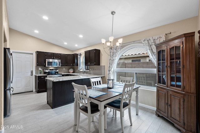 1770 W Derringer Way, Chandler, AZ 85286 - dining room featuring recessed lighting, vaulted ceiling, light wood finished floors, and a chandelier