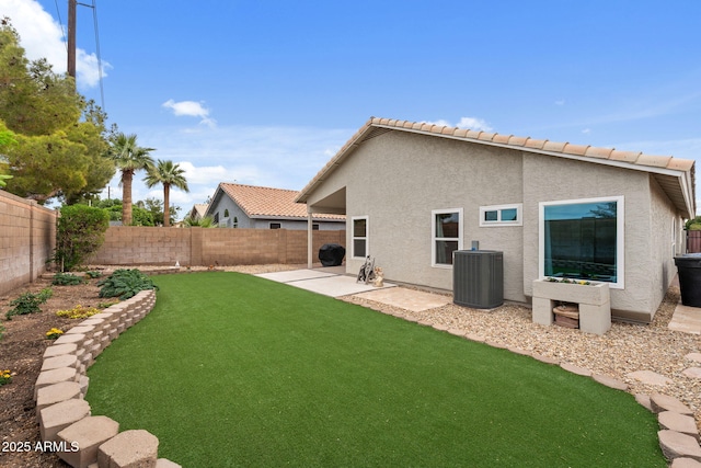1770 W Derringer Way, Chandler, AZ 85286 - rear view of house with cooling unit, a patio, a fenced backyard, stucco siding, and a yard