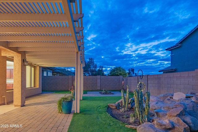 view of yard with a fenced backyard, a pergola, and a patio