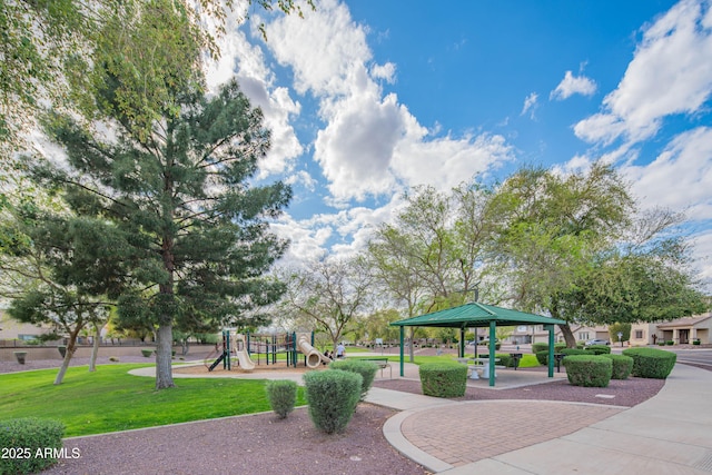 view of community with a gazebo, a yard, and playground community