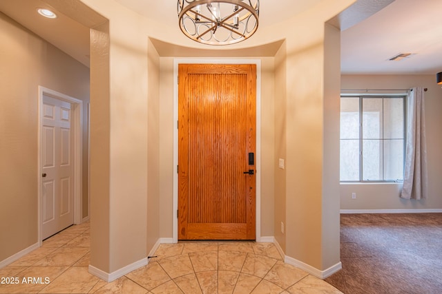 entryway featuring recessed lighting, baseboards, visible vents, and a chandelier