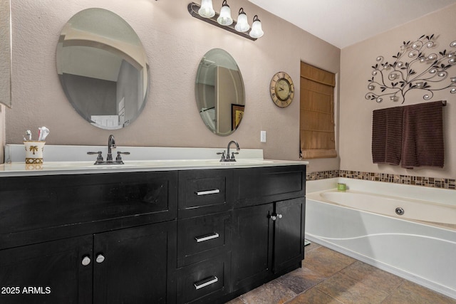 bathroom with vanity and a bathtub