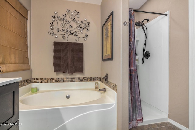 bathroom with independent shower and bath, vanity, and tile patterned floors