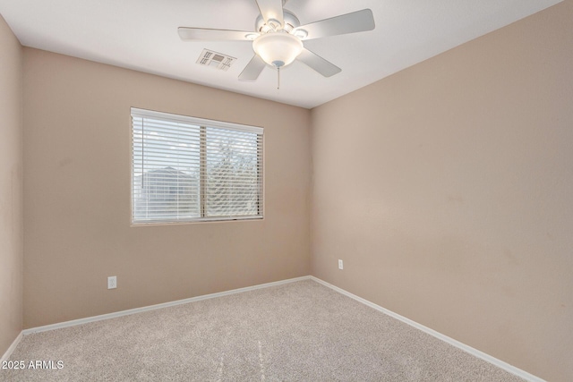 unfurnished room with ceiling fan and carpet floors