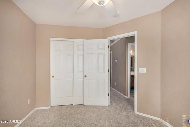 unfurnished bedroom with carpet floors, a closet, and ceiling fan