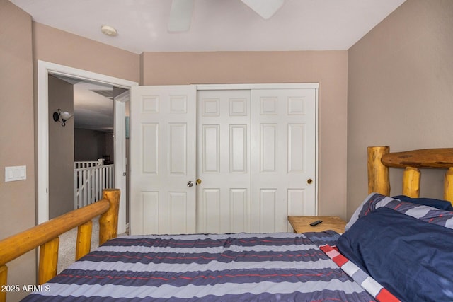 bedroom featuring ceiling fan and a closet