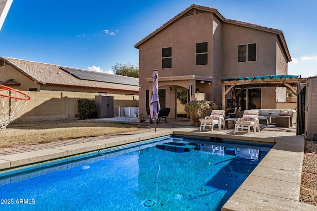 rear view of house with a patio, an outdoor hangout area, and a pergola