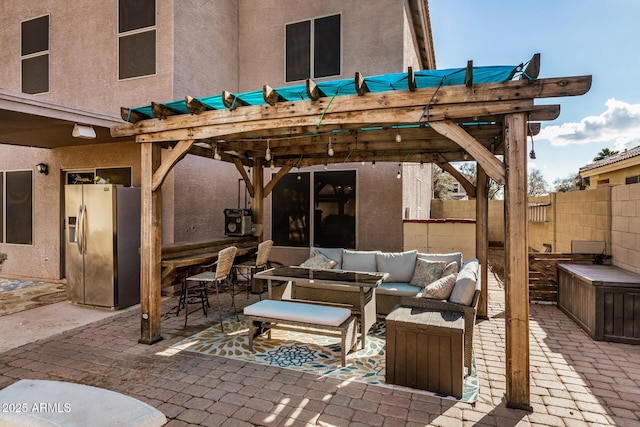 view of patio with outdoor lounge area and a pergola