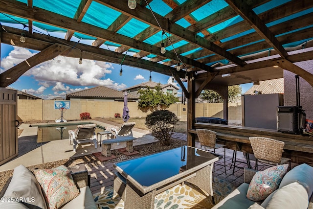 view of patio / terrace with a bar, a pergola, and outdoor lounge area