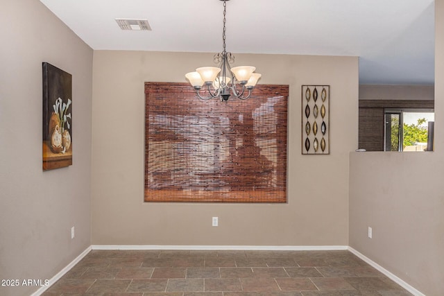 dining room featuring a notable chandelier