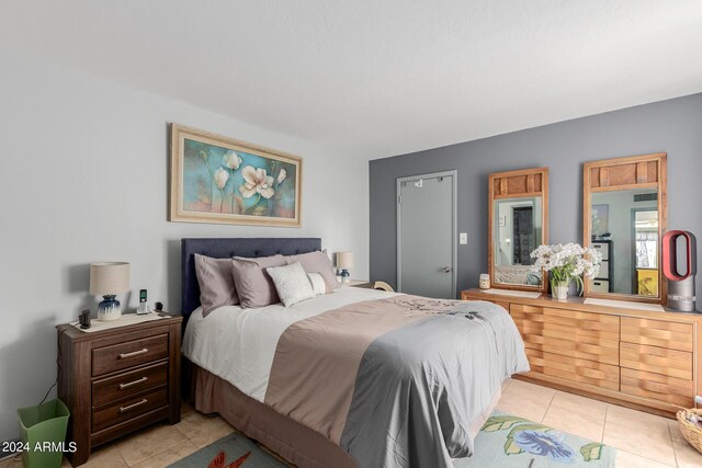 bedroom with light tile patterned floors