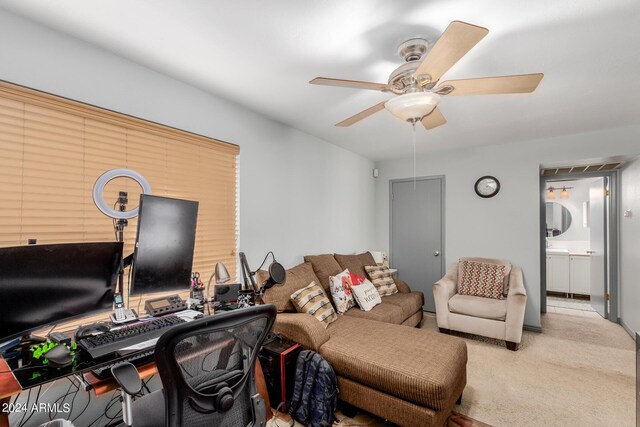 living room with carpet flooring and ceiling fan