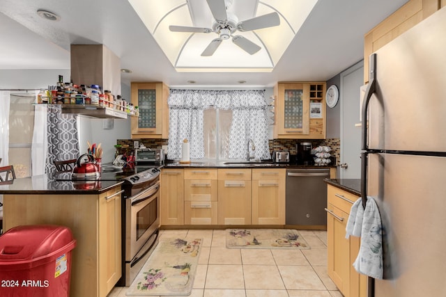 kitchen featuring ceiling fan, decorative backsplash, light tile patterned floors, sink, and stainless steel appliances