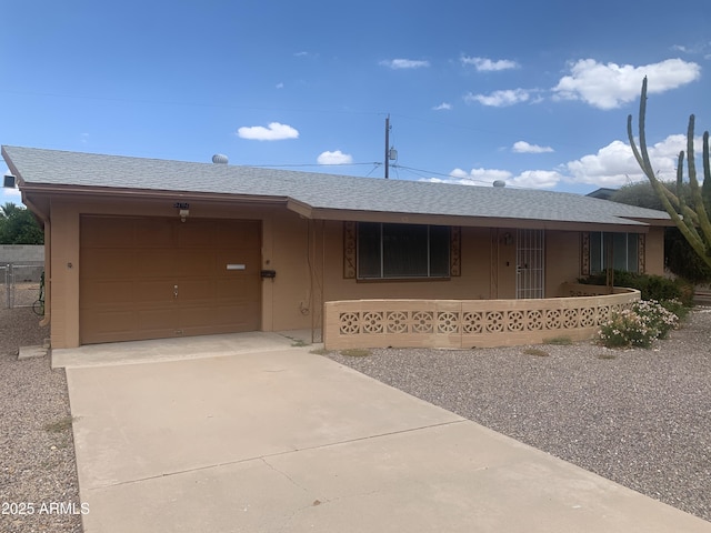 5702 E Casper Rd, Mesa, AZ 85205 - ranch-style house with driveway, an attached garage, a shingled roof, and a porch